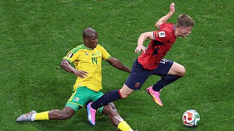 South Africa's Mbekezeli Mbokazi (14) tackles Czechia's Lukas Cerv (12) during the World Cup Group A football match between Czechia and South Africa in Atlanta, Thursday, June 18, 2026.