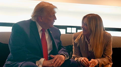 In this handout picture released by the Palazzo Chigi Press Office on June 17, 2026 US President Donald Trump speaks with Italy's Prime Minister Giorgia Meloni during the G7 summit in Evian, eastern France, on June 17, 2026.