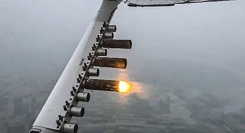 The process involves dispersing substances such as silver iodide and other compounds into suitable clouds.