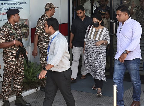 Enforcement Directorate officials, along with T Veena, daughter of ex-Kerala Chief Minister Pinarayi Vijayan, visit the HDFC Bank to check her locker as part of the ongoing probe in the Cochin Minerals and Rutile Limited (CMRL) and Exalogic Solutions case, in Thiruvananthapuram on Friday, June 19, 2026.