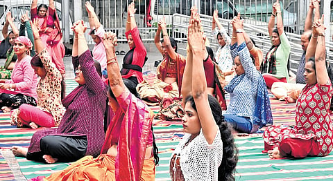People take part in a yoga session on the eve of International Yoga Day in Bengaluru on Saturday | Shashidhar Byrappa