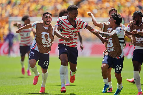 US players run to celebrate on Friday