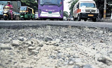 A big pothole makes life miserable for motorists in Timberyard Layout on Mysuru Road on Saturday.