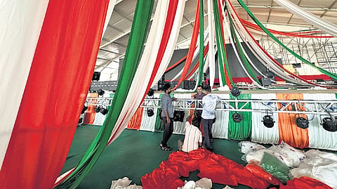 Workers make arrangements at the venue where MLC BK Hariprasad will take charge as KPCC chief at Palace Grounds in Bengaluru on Saturday