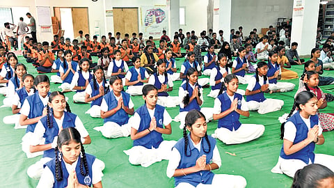 Students take part in an event organised by The New Indian Express in Nalgonda on Saturday, the eve of International Day of Yoga.