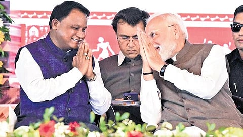 PM Narendra Modi and CM Mohan Charan Majhi share a lighter moment in Mayurbhanj meeting.