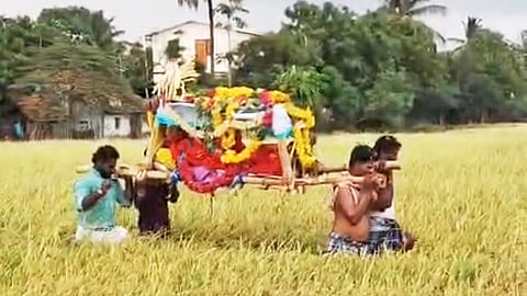 Dalit residents carry a corpse through paddy fields in Theeyathur village of Avudaiyarkoil taluk, Pudukkottai district, on Friday, as the absence of a proper pathway continues to hinder access to the cremation ground.