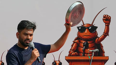 Abhijeet Dipke, founder of the Cockroach Janta Party speaks during a protest demanding the resignation of Education Minister Dharmendra Pradhan over alleged examination irregularities and repeated paper leaks, in New Delhi , Saturday, June 20, 2026.