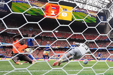 Netherlands' Brian Brobbey (19) scores their second goal past Sweden goalkeeper Kristoffer Nordfeldt (23) during the World Cup Group F soccer match between the Netherlands and Sweden in Houston, Saturday, June 20, 2026. 