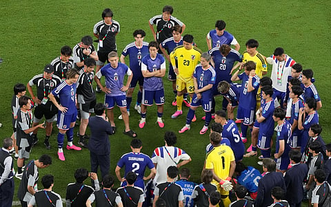 Japan's team gather after defeating Tunisia in a World Cup Group F tie in Guadalupe, near Monterrey (Mexico) on Sunday
