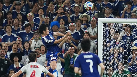 Japan's Ayase Ueda, center, scores their fourth goal with a header against Tunisia during the World Cup Group F soccer match in Guadalupe, near Monterrey, Mexico, Saturday, June 20, 2026. 