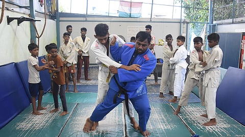 D Sarathy leads a judo practice session, training children from a Chennai shelter.
