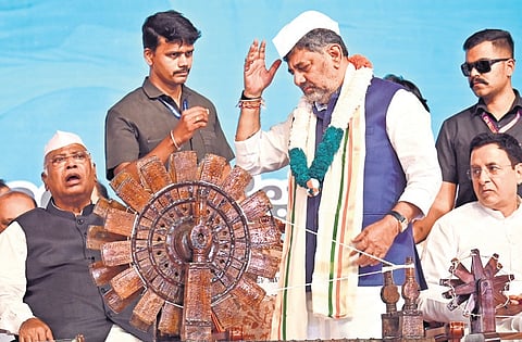 Chief Minister D K Shivakumar, AICC president Mallikarjun Kharge and AICC general secretary in charge of Karnataka Randeep Singh Surjewala at a rally at which BK Hariprasad took charge as KPCC president in Bengaluru on Sunday 