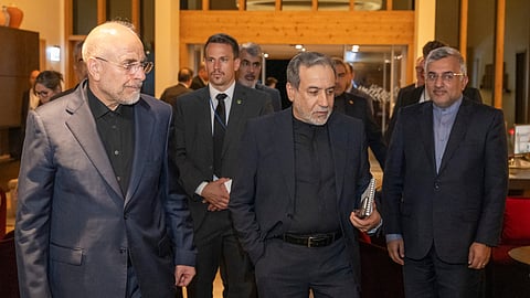 Iranian Foreign Minister Seyyed Abbas Araghchi, center, and Speaker of the Islamic Parliament of Iran Mohammed Bagher Ghalibaf, left, arrive at the Buergenstock resort in Obbuergen, near Lucerne, Switzerland, early Sunday, June 21, 2026.