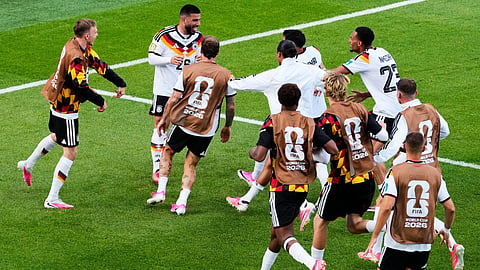 Germany's Deniz Undav (26) is mobbed by teammates after scoring their second goal during the World Cup Group E soccer match between Germany and Ivory Coast in Toronto, Saturday, June 20, 2026. 