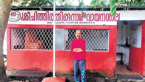 P Ravindran in front of Sri Chithira Thirunal Vayanashaala