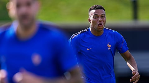 France's Kylian Mbappe smiles during a training session ahead of the team's World Cup Group I soccer match against Iraq in Philadelphia, Sunday, June 21, 2026. 