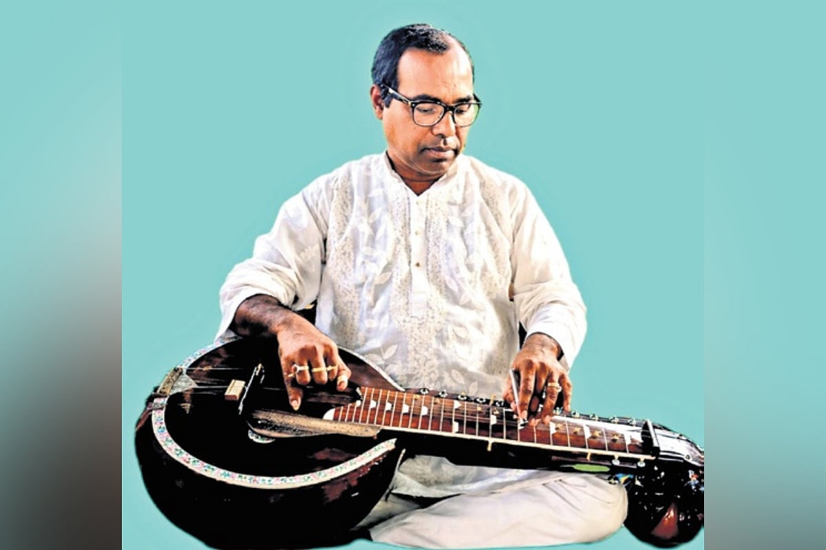 School headmaster from Tripura develops 22-string modified guitar for classical music need