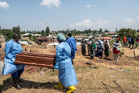 Red Cross workers prepare to bury Vanisa Anifa, a 6-month-old orphaned girl who died of Ebola, at the Bigo Cemetery, in Bunia, Congo, Friday, June 19, 2026. 