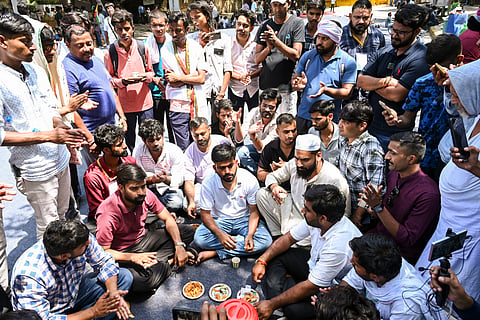  Cockroach Janta Party (CJP) founder Abhijeet Dipke, front centre, with supporters on the third day of a protest over alleged examination irregularities, repeated paper leaks and demands for accountability from the government, in New Delhi, Monday, June 22, 2026. 