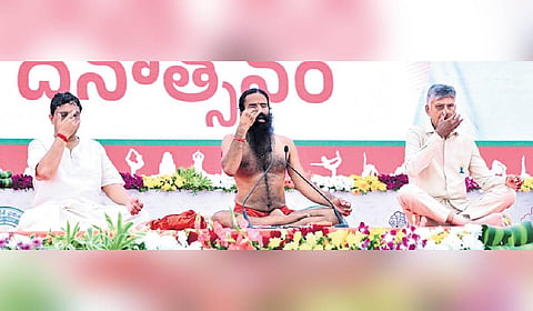 CM Chandrababu Naidu takes part in the Yoga Day celebrations, along with Yoga Guru Baba Ramdev, at the IGMC Stadium in Vijayawada on Sunday 
