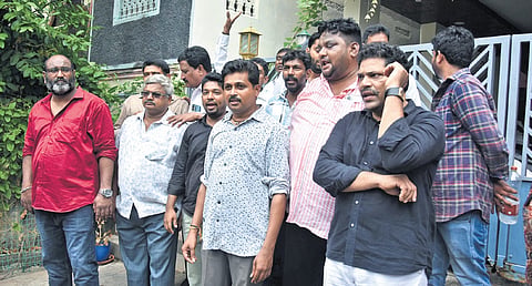 Supporters gather at the suspended Krishna Lanka CI Nagaraju’s house at Ajit Singh Nagar in Vijayawada on Sunday.