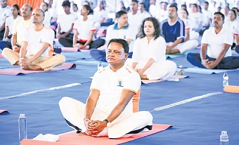 CM Mohan Charan Majhi practising yoga at Kalinga Stadium, on Int’l Yoga Day