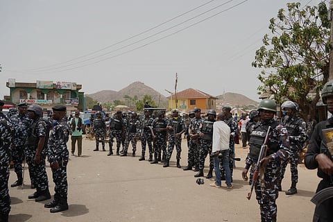 Police officers gather at the scene of a gunmen attack in Gari Ya Waye community in the Jos North, Nigeria, March 30, 2026.