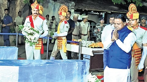 CM Mohan Charan Majhi paying his last respects to the victims at Bhubaneswar airport on Tuesday