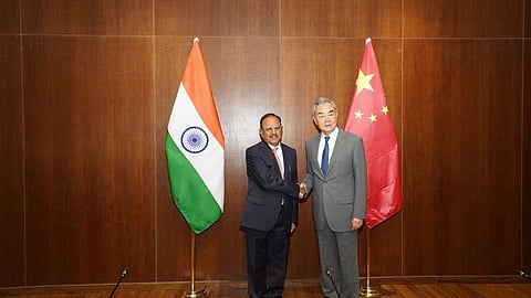 NSA Ajit Doval with Chinese Foreign Minister Wang Yi in New Delhi on Monday.