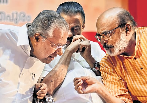 Leader of Opposition Pinarayi Vijayan with former finance minister Thomas Isaac and CPM state secretary M V Govindan during the seminar at the AKG Centre on Tuesday.