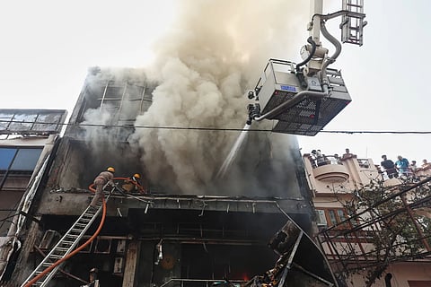Firefighters battling the blaze in Lucknow on Monday