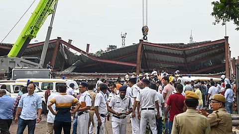 Officials gather after a three-storey under-construction warehouse collapsed in the Taratala area in Kolkata, West Bengal, on Wednesday, June 24, 2026.