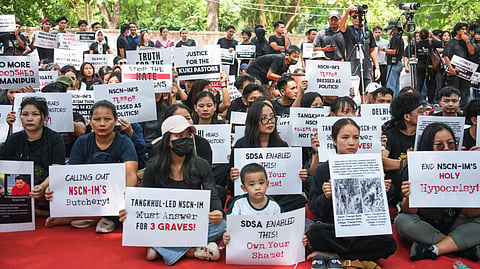 In this photo from May 16, 2026, members of the Kuki community stage a protest against the killing of three church leaders in Manipur at Jantar Mantar in New Delhi.