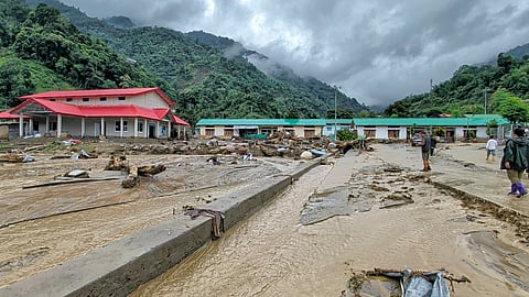 Debris scattered across an area after a landslide and flash floods near the NEEPCO project colony, Keyi Panyor district.