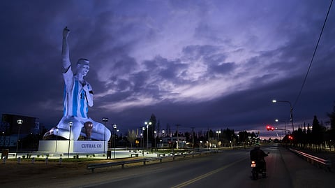 A sculpture of soccer star Lionel Messi by artist Aldo Beroisa, that was unveiled for Argentina's opening World Cup match against Algeria, stands in Cutral Co, Argentina, at sunrise Sunday, June 21, 2026. 