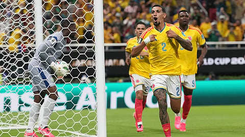 Colombia's Daniel Munoz (2) celebrates after scoring his side's opening goal during the World Cup Group K soccer match between Colombia and Congo in Zapopan, near Guadalajara, Mexico, Tuesday, June 23, 2026.