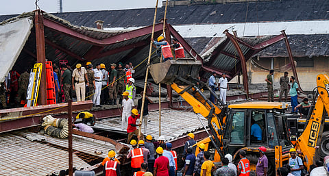 Officials and others gather during a rescue operation after a three-storey under-construction warehouse collapsed at Taratala area, in Kolkata, West Bengal, Wednesday, June 24, 2026.