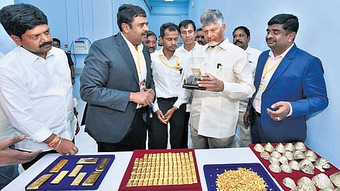 CM Chandrababu Naidu examines gold at the inauguration of Jonnagiri Gold Mining Project in Kurnool district.