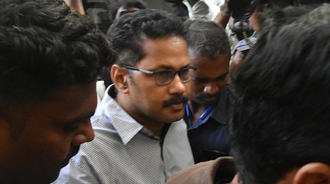 Police produce Krishnalanka CI Nagaraju, who is involved in the disappearance of rowdy sheeter Sai Krishna, in the court in Vijayawada on Wednesday. 
