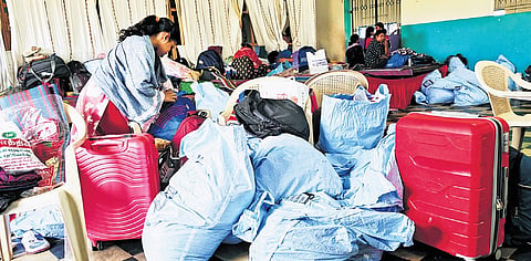 Migrant workers making arrangements to leave for their native from the camp in Kannigaipair in Tiruvallur 
