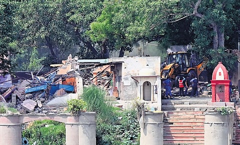 DDA carries out a demolition drive in the Yamuna Bazar area on Thursday to clear the encroachment after fresh eviction notices were issued to the residents.
