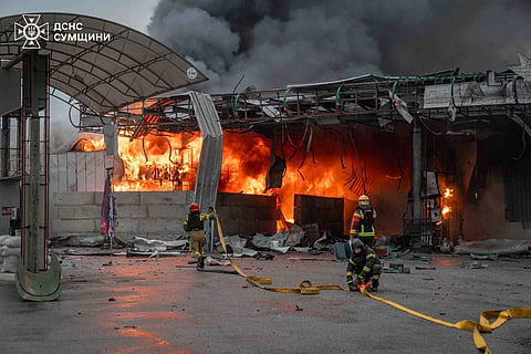 In this photo provided by the Ukrainian Emergency Service, firefighters put out a fire in a gas station following a Russian air attack in Sumy, Ukraine, Thursday, June 25, 2026.