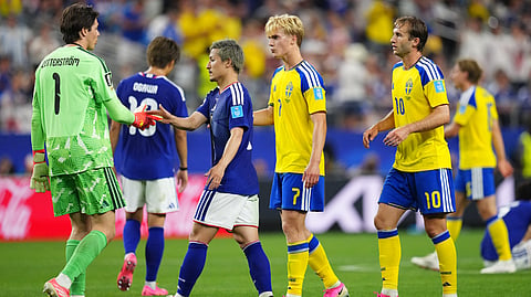 Japan's Daizen Maeda, center, greets to Sweden goalkeeper Jacob Widell Zetterstrom after the World Cup Group F soccer match in Arlington, Texas, near Dallas, Thursday, June 25, 2026. 