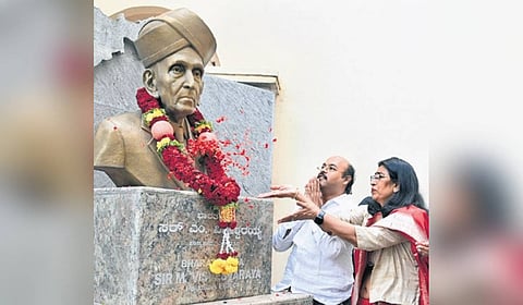 Urban Development Minister Dr Yathindra Siddaramaih offers flowers to a bust of Sir M Visvesvaraya at the MSME Day 2026 celebrations on Thursday.