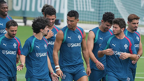 Portugal's Vitinha gestures to Cristiano Ronaldo during the team's World Cup training session Thursday, June 25, 2026, in Palm Beach Gardens, Fla. 