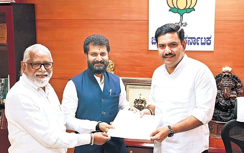 BJP MLC CT Ravi and party state vice-president N Mahesh submit the fact-finding committee’s report on cross-voting in the recent MLC polls, on Saturday