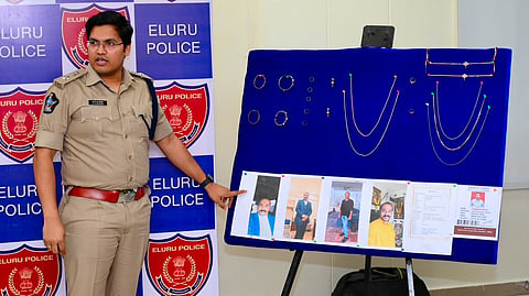 Eluru District SP Kommu Pratap Siva Kishore displays the gold ornaments, mobile phones, ATM cards, bank passbooks and other items recovered from an interstate matrimonial fraud accused during a press conference in Eluru on Friday.