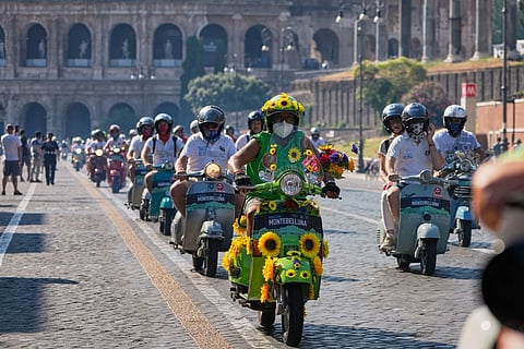  Vespa enthusiasts parade in front of the Colosseum during celebrations for the 80th anniversary of the Vespa scooter, in Rome, Saturday, June 27, 2026.