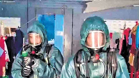 NDRF personnel clearing the living quarters of the migrant workers near the seafood export unit in Tiruvallur on June 21.